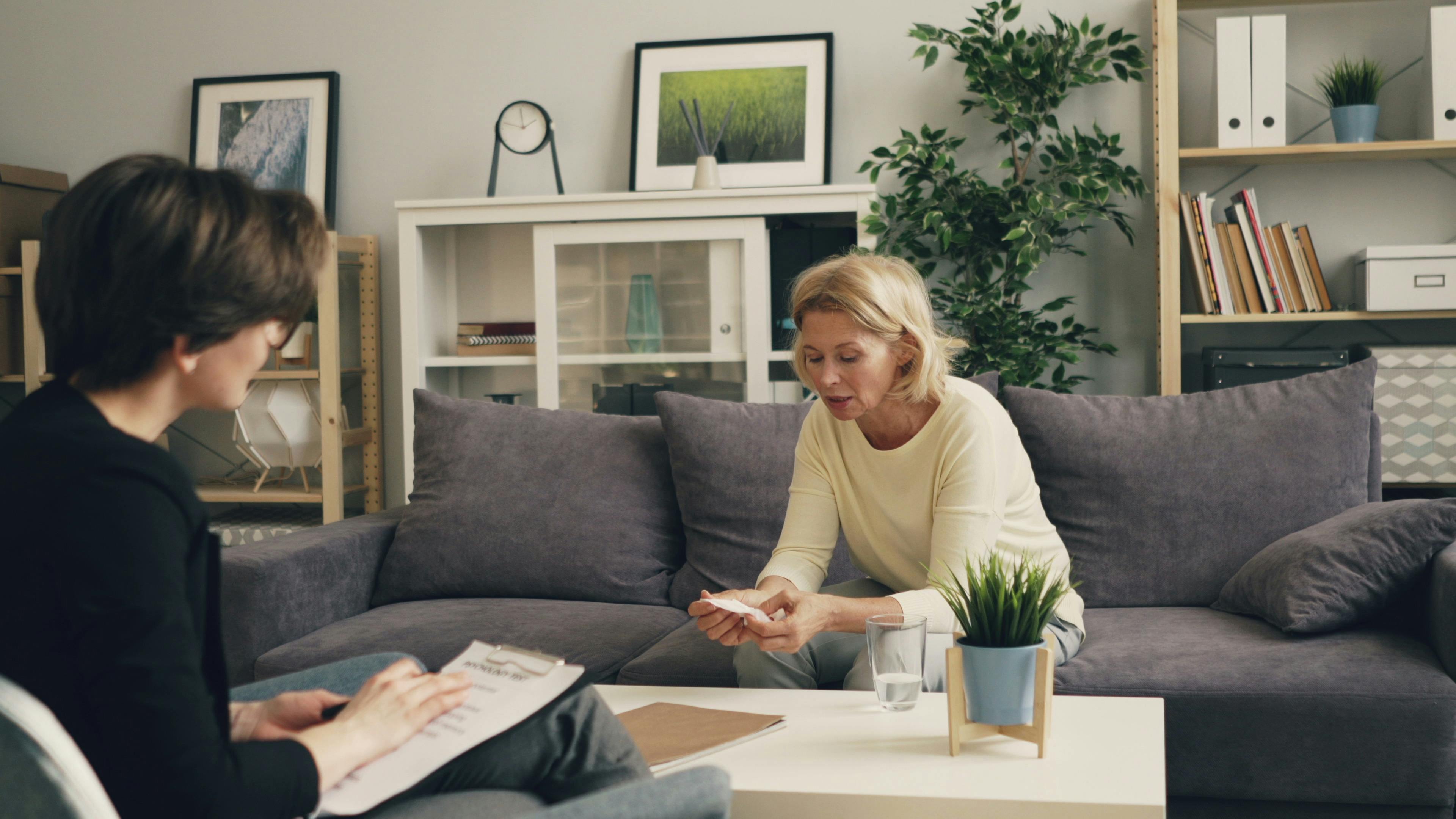 [A pharmacist consulting with a patient in a private consultation room at a Wigston pharmacy]